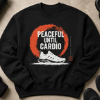 Black sweatshirt with "Peaceful Until Cardio" graphic and running shoe.