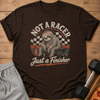 Brown t-shirt with sloth graphic reading "Not a Racer, Just a Finisher."