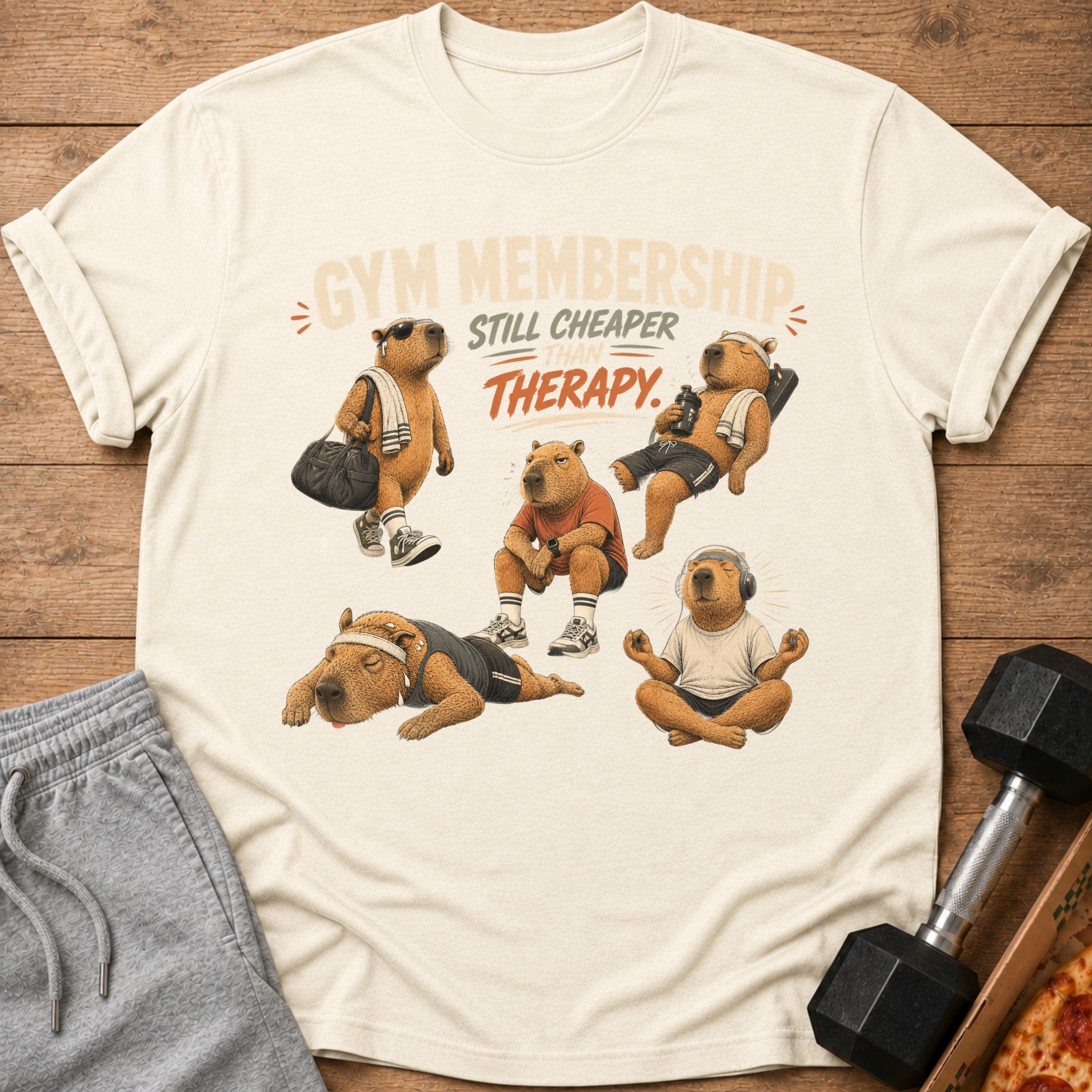 T-shirt with capybaras in gym poses and text: Gym membership still cheaper than therapy.