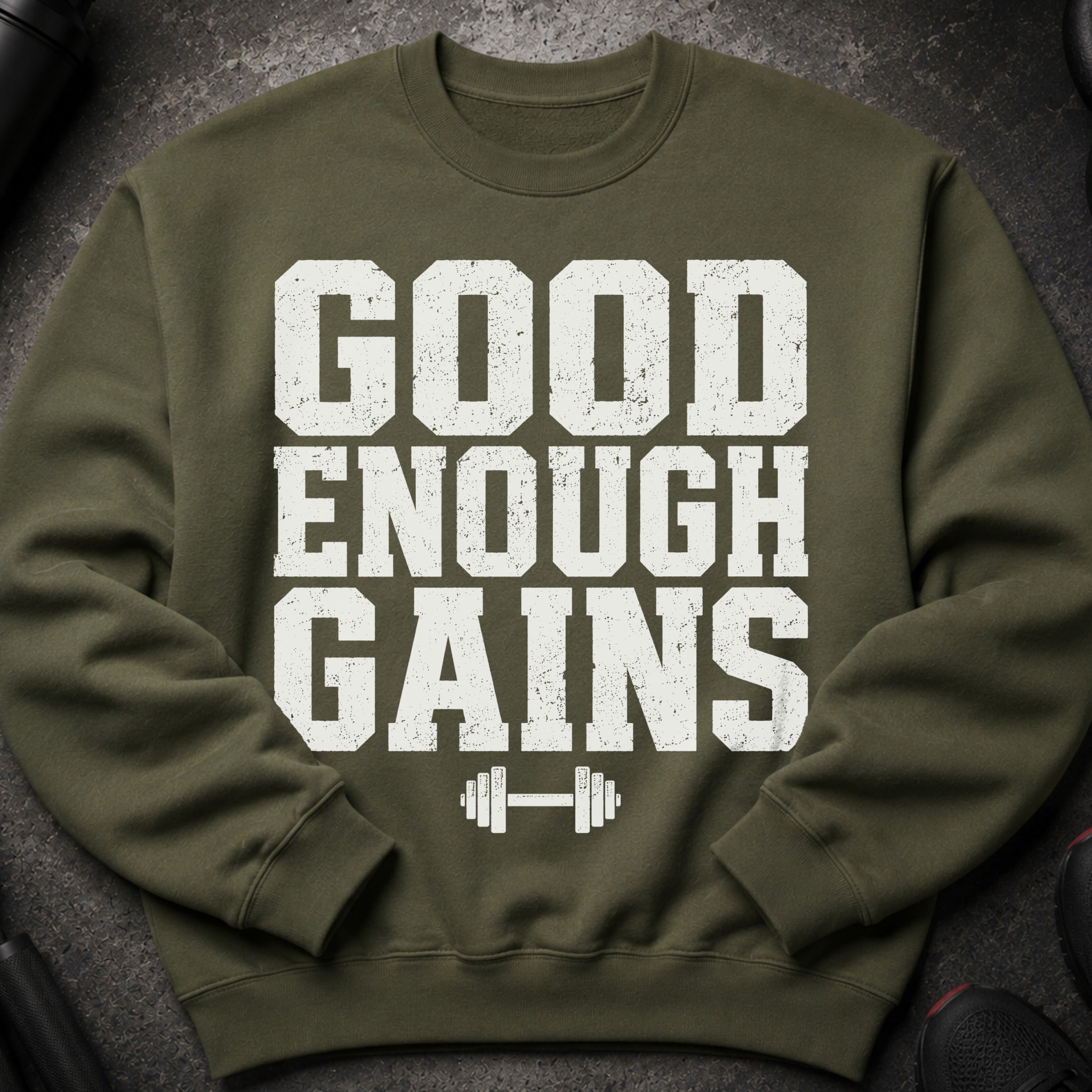 Olive green sweatshirt with "GOOD ENOUGH GAINS" and a dumbbell graphic.