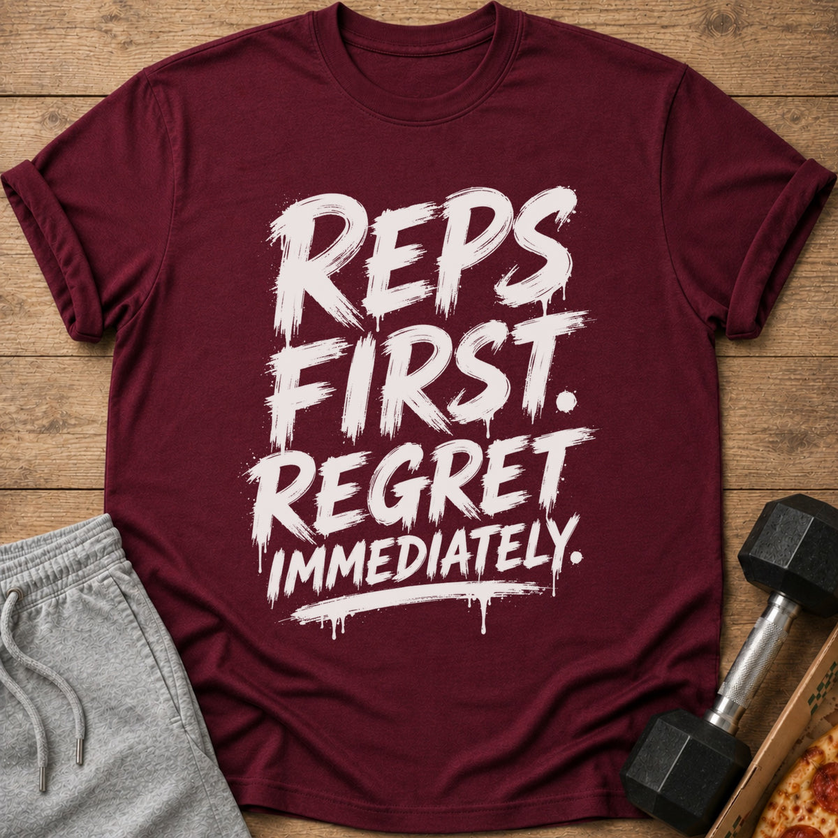 Maroon t-shirt with white text "REPS FIRST. REGRET IMMEDIATELY."