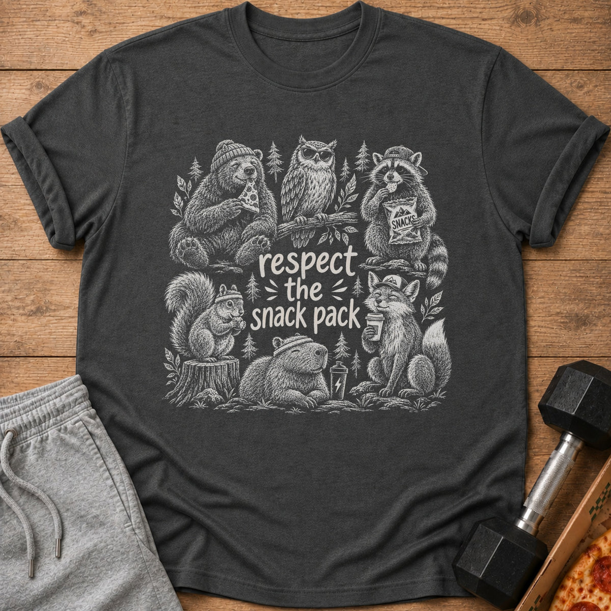 Graphic t-shirt with animals eating snacks and text "respect the snack pack".