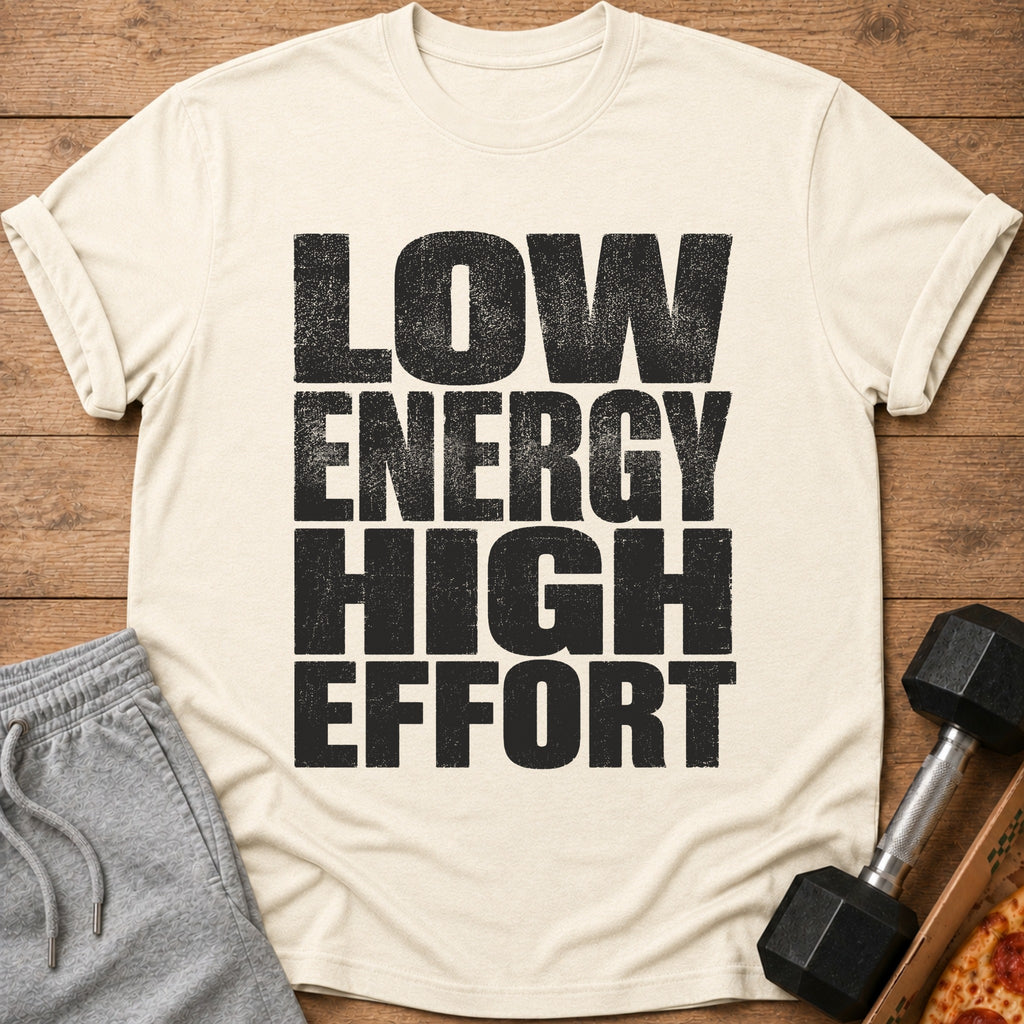 Light cream t-shirt with distressed black text reading "LOW ENERGY HIGH EFFORT".