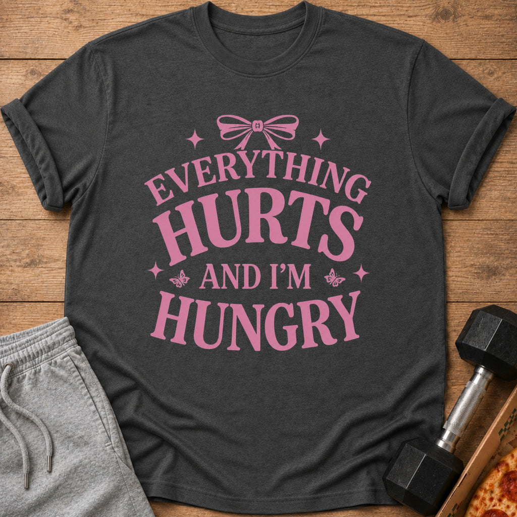 Dark grey t-shirt with pink text "EVERYTHING HURTS AND I'M HUNGRY".
