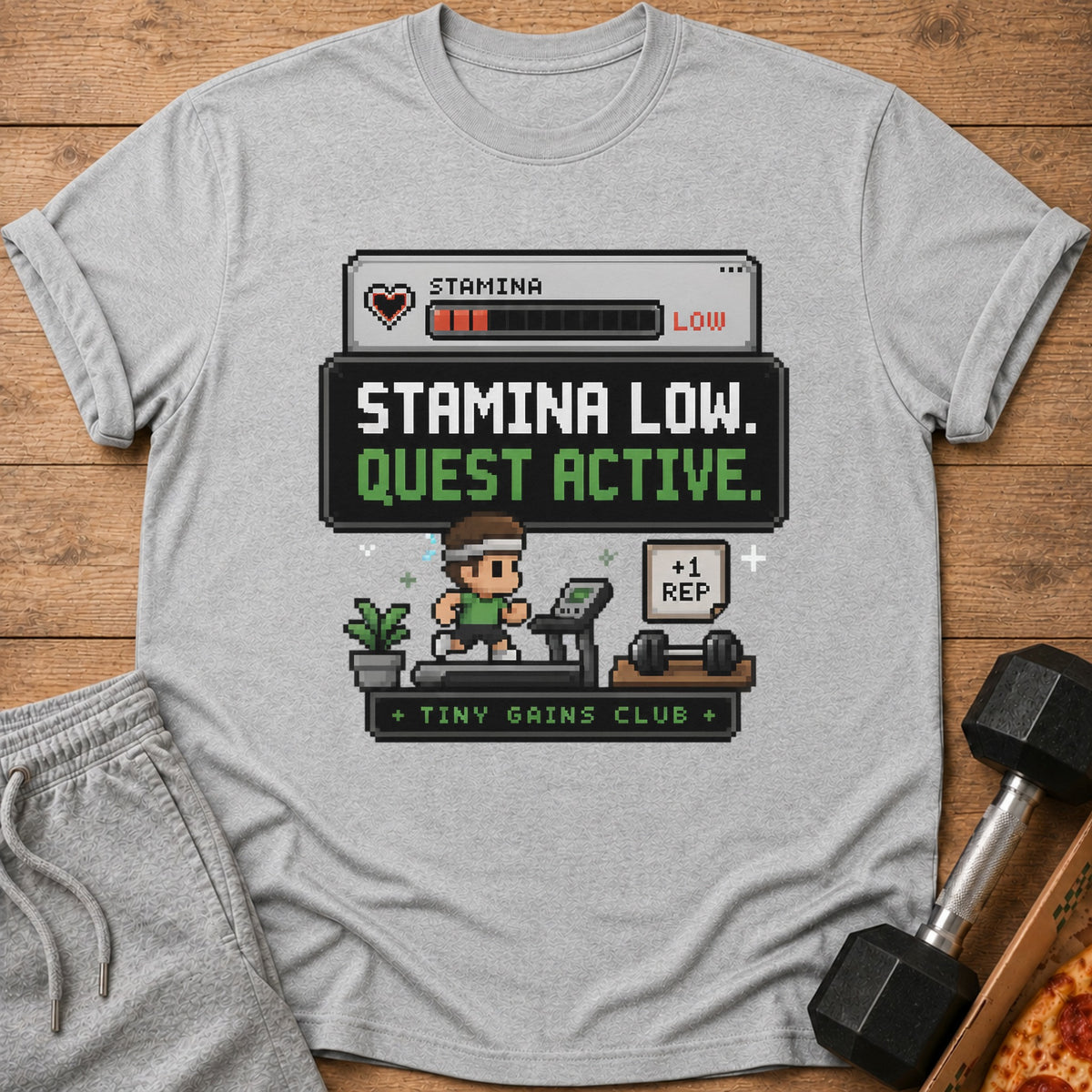 Pixel art shirt with "Stamina Low. Quest Active." and "Tiny Gains Club" text.