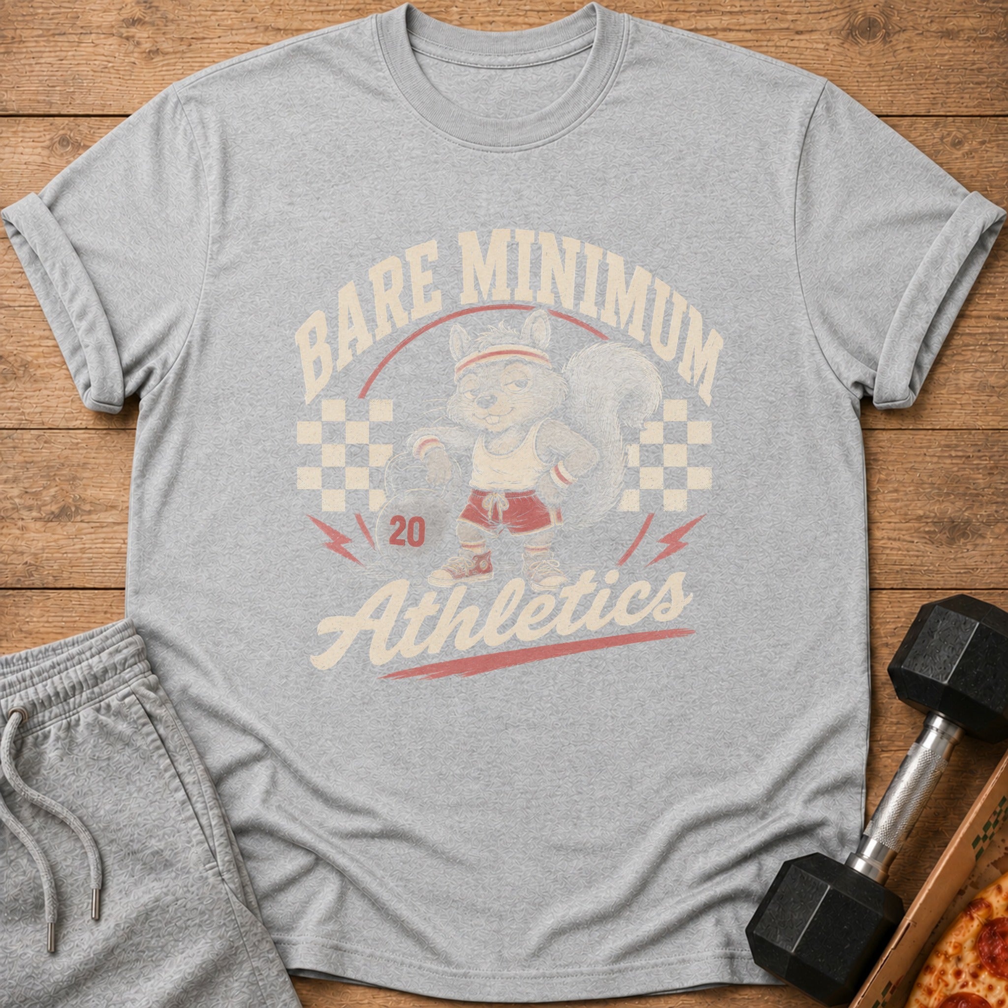 Grey t-shirt with a cartoon squirrel in athletic wear and text "Bare Minimum Athletics"