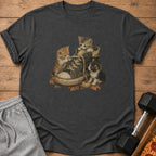 Three kittens play with laces in a worn canvas sneaker, surrounded by autumn leaves.