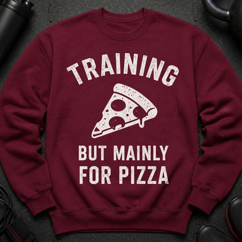 Maroon sweatshirt with white text "TRAINING BUT MAINLY FOR PIZZA" and a pizza slice graphic.