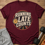 Maroon t-shirt with "Running Late Counts" graphic featuring a stopwatch and road.