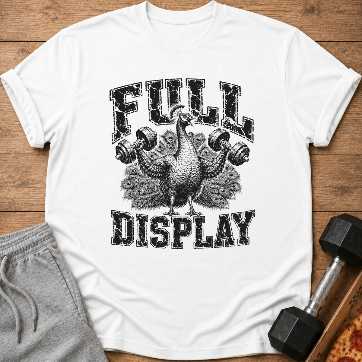 White t-shirt with a distressed graphic of a peacock lifting dumbbells, text reads "FULL DISPLAY".