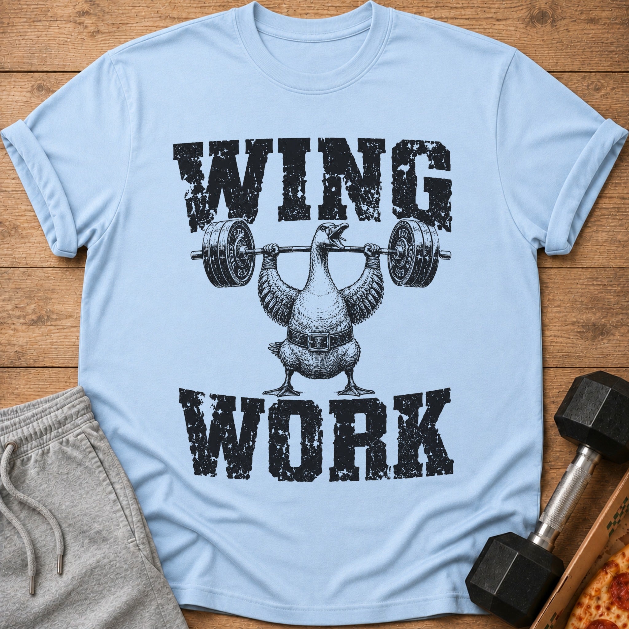 Light blue t-shirt with "WING WORK" text and a duck lifting weights.