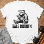 White t-shirt with a bear lifting a dumbbell and the text "BARE MINIMUM."