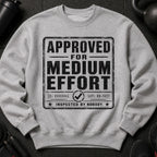 Gray sweatshirt with "APPROVED FOR MEDIUM EFFORT INSPECTED BY NOBODY" text.