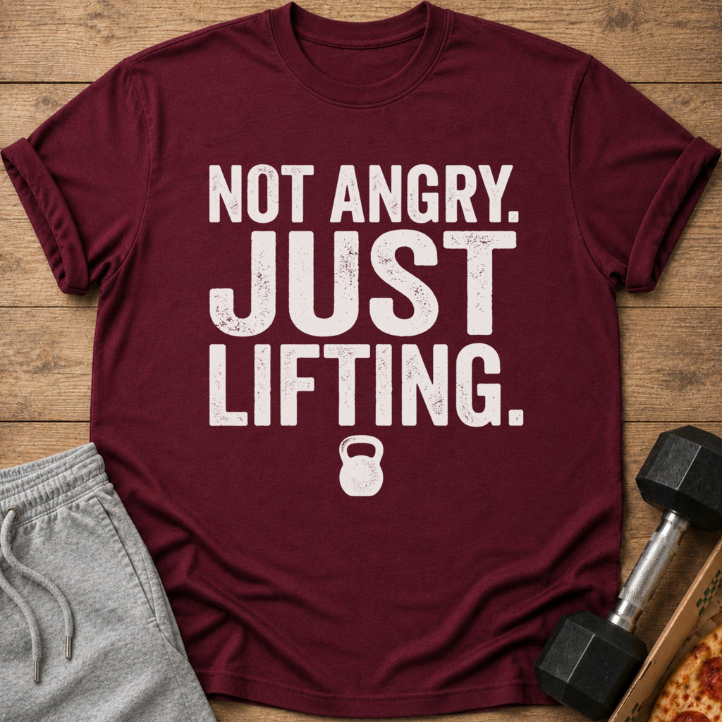 Maroon t-shirt with white text "NOT ANGRY. JUST LIFTING." and a kettlebell icon.