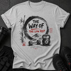 Gray t-shirt with "The Way of The Low Rep" text, bamboo, mountains, dumbbell, and kettlebell.
