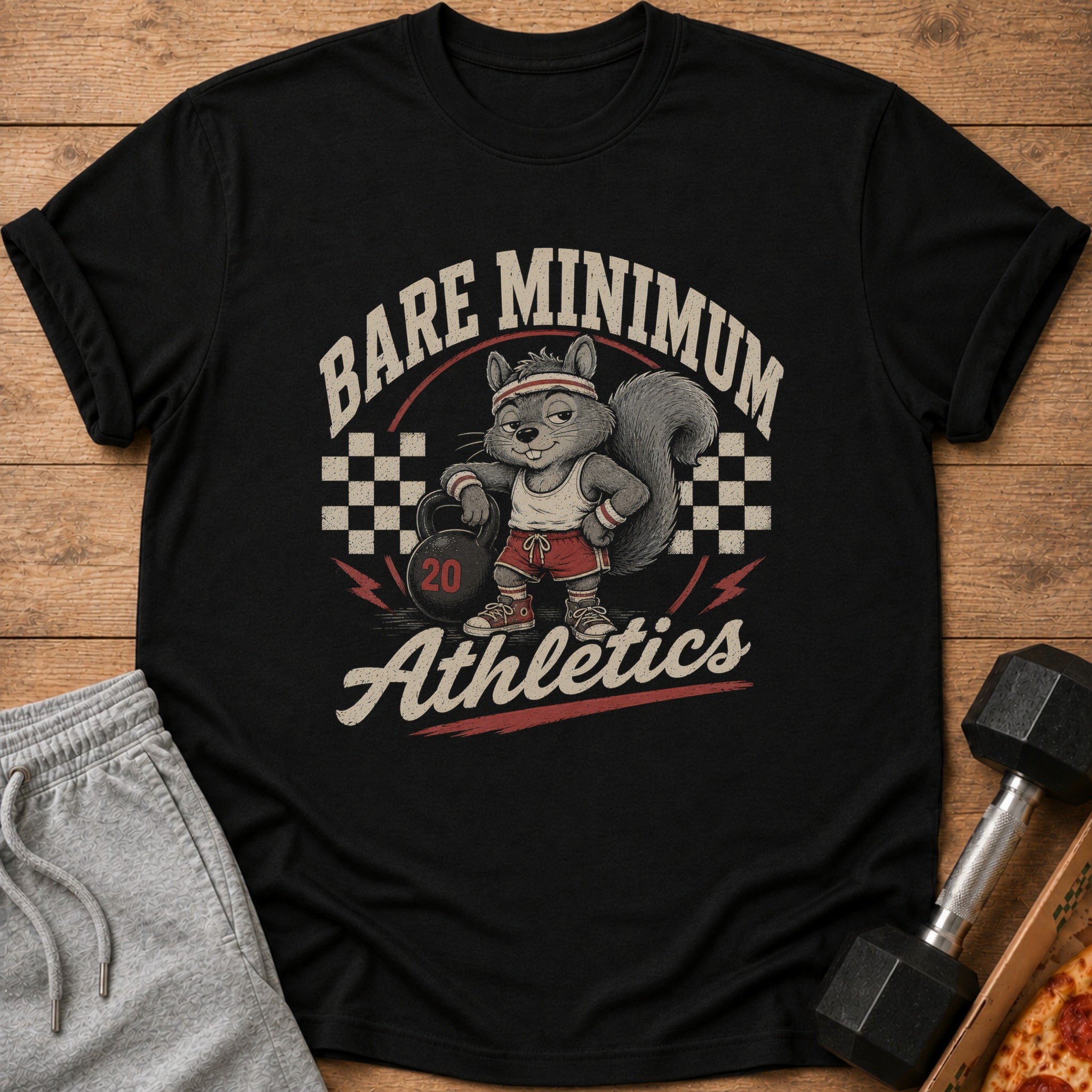 Black t-shirt with a cartoon squirrel holding a kettlebell, text "Bare Minimum Athletics".