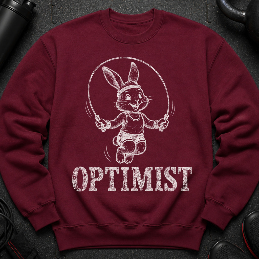 Maroon sweatshirt with a jumping rabbit graphic and the word OPTIMIST.