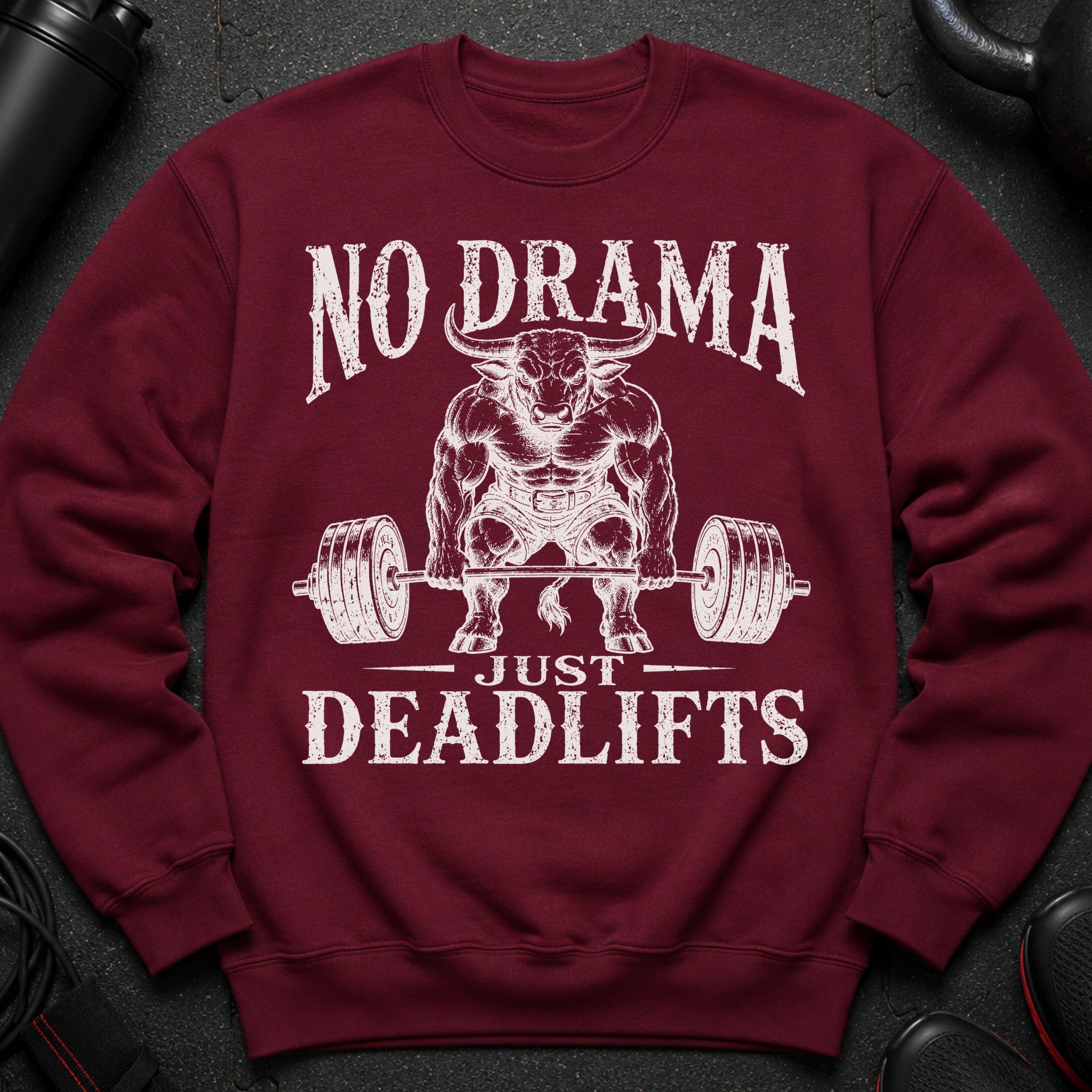 Maroon sweatshirt with graphic text "NO DRAMA JUST DEADLIFTS" and muscular bull.