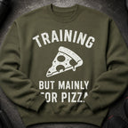 Olive green sweatshirt with "TRAINING BUT MAINLY FOR PIZZA" graphic and a pizza slice.