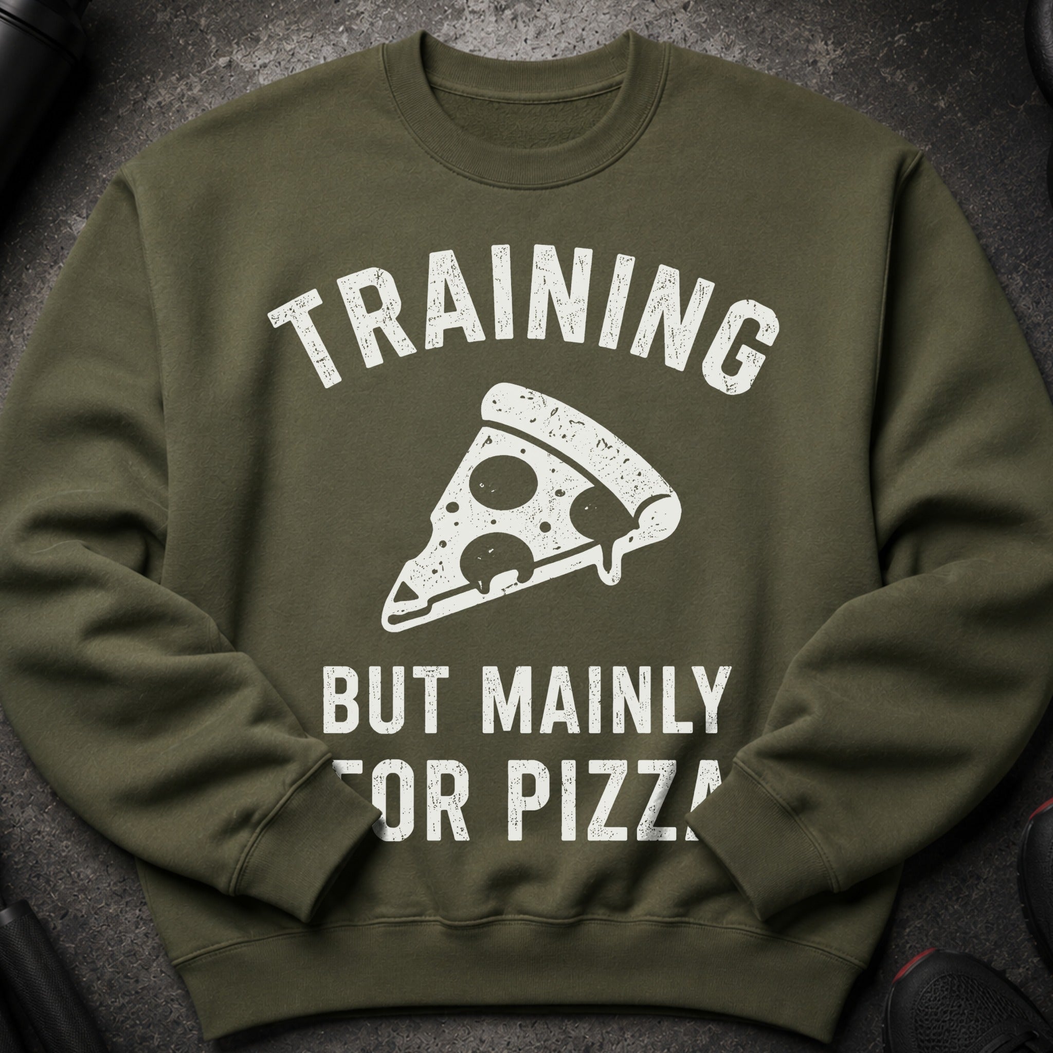Olive green sweatshirt with "TRAINING BUT MAINLY FOR PIZZA" graphic and a pizza slice.