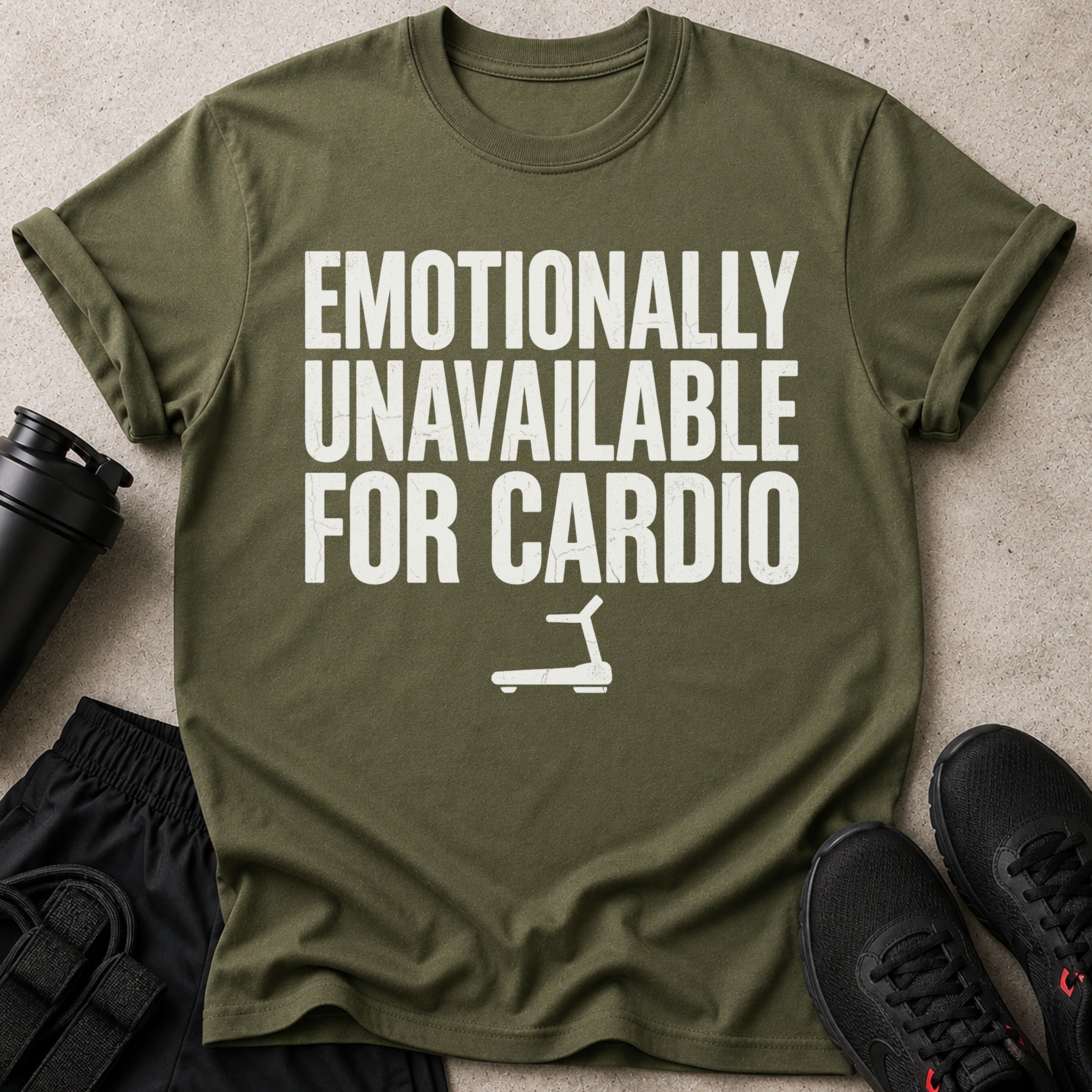 Olive green t-shirt with "EMOTIONALLY UNAVAILABLE FOR CARDIO" text and treadmill graphic.