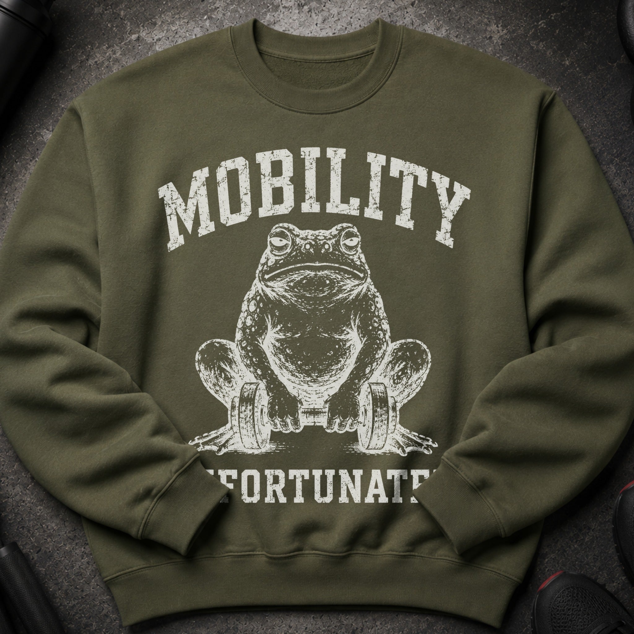 Olive green sweatshirt with white distressed print of a frog holding dumbbells and text "MOBILITY FORTUNATE".