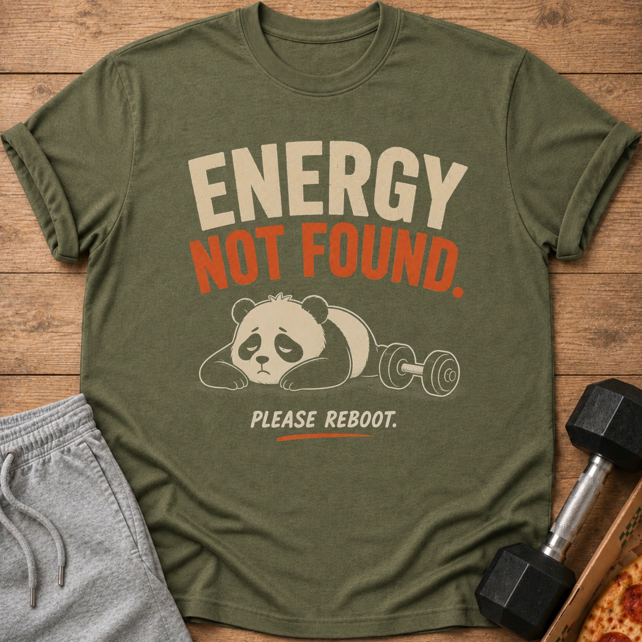 Green t-shirt with a panda lying next to a dumbbell and text "ENERGY NOT FOUND. PLEASE REBOOT."