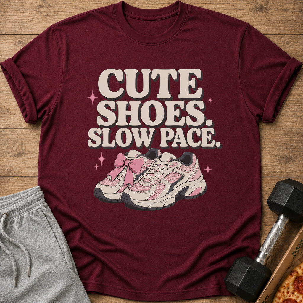 Maroon t-shirt with "CUTE SHOES. SLOW PACE." text and pink sneakers.