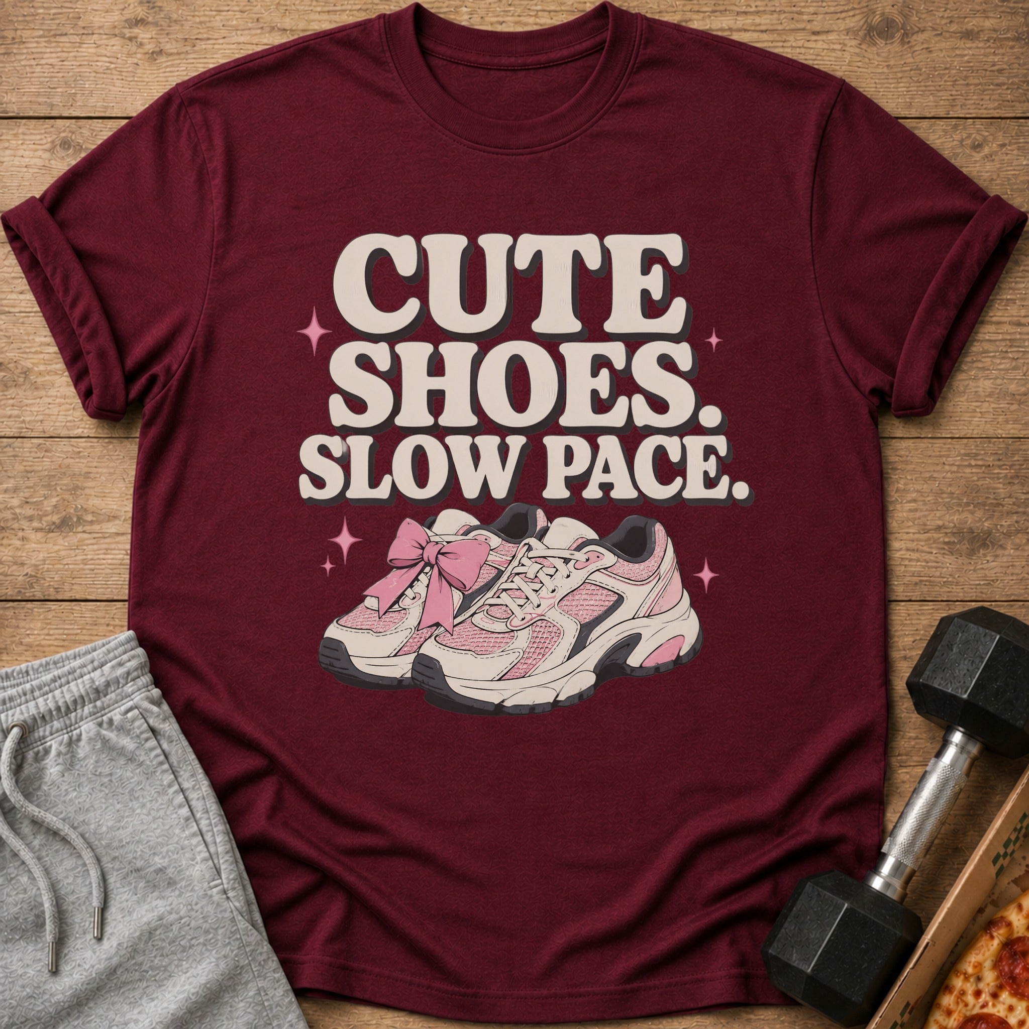 Maroon t-shirt with "CUTE SHOES. SLOW PACE." text and pink sneakers.