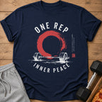 Navy t-shirt with barbell, red circle, and text "ONE REP INNER PEACE".