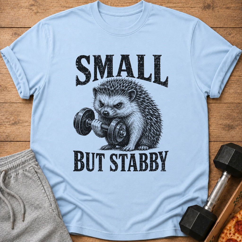 Light blue t-shirt with a hedgehog lifting a dumbbell and text "SMALL BUT STABBY".