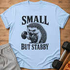 Light blue t-shirt with a hedgehog lifting a dumbbell and text "SMALL BUT STABBY".