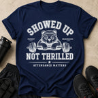 Navy t-shirt with graphic: "Showed Up, Not Thrilled, Attendance Matters."