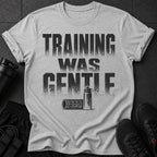 Gray t-shirt with distressed text "TRAINING WAS GENTLE" and graphics of fitness equipment.