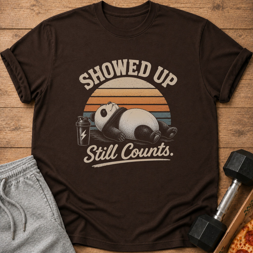 Brown t-shirt with a panda, shaker bottle, and text "Showed Up Still Counts."
