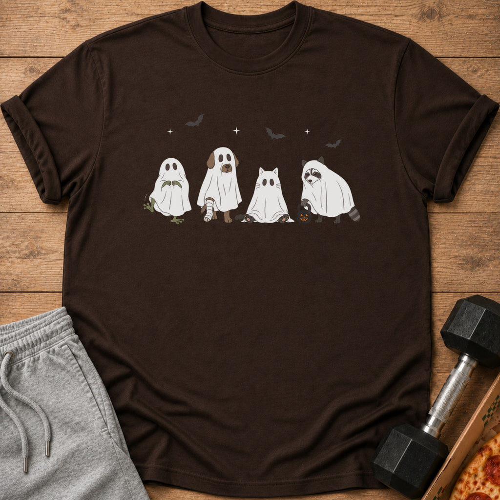 Brown t-shirt with cartoon ghosts of a frog, dog, cat, and raccoon on it.