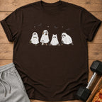 Brown t-shirt with cartoon ghosts of a frog, dog, cat, and raccoon on it.