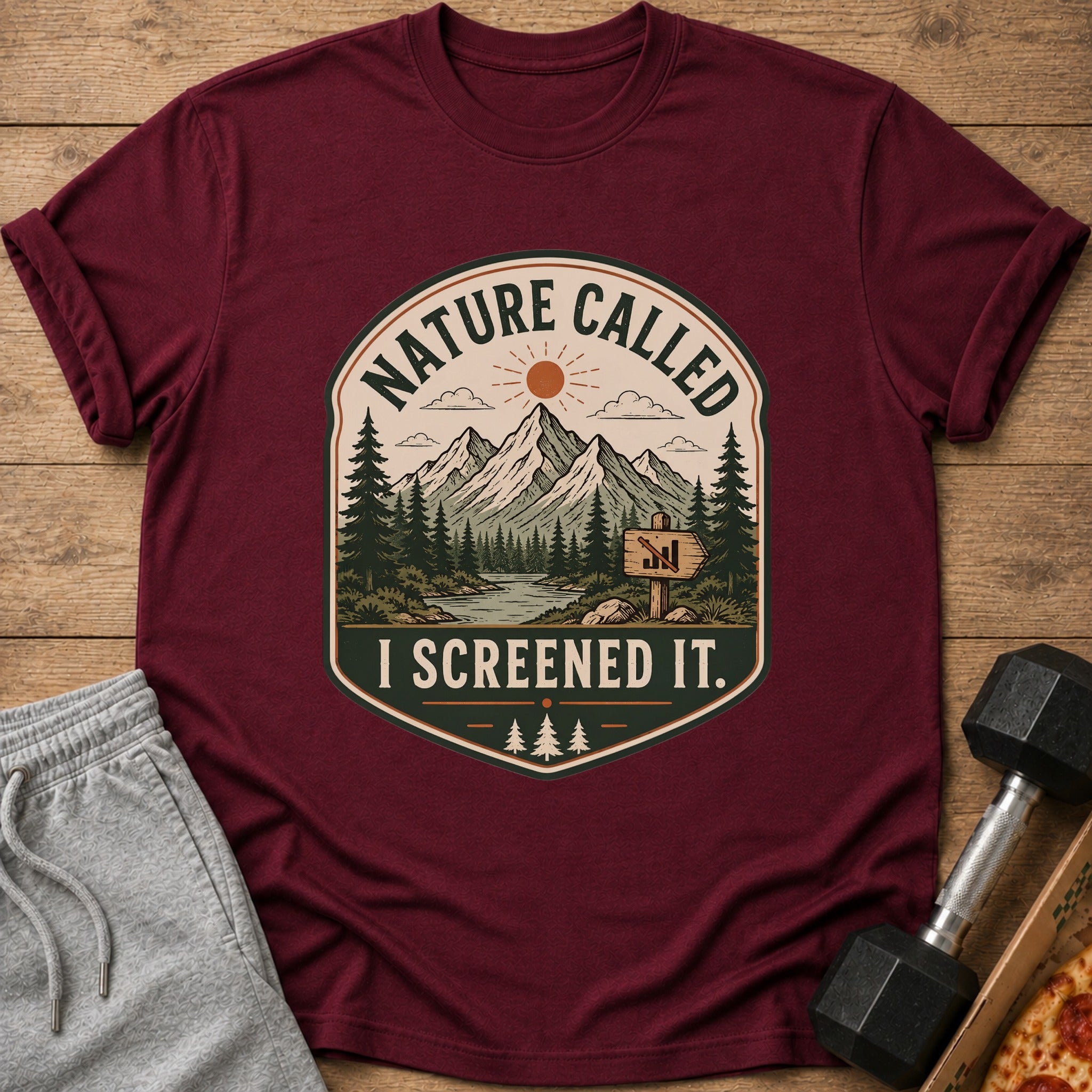 Maroon t-shirt with "Nature Called I Screened It" mountain graphic.