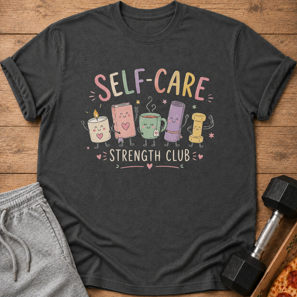 T-shirt with "Self-Care Strength Club" text and cute cartoon candle, book, tea, yoga mat, and bolt characters.