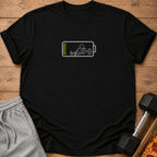 Black t-shirt with a white graphic of a stick figure with a barbell inside a low battery symbol.