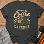 T-shirt graphic of a bear holding coffee, "Powered by Coffee Caffeine & Regret."