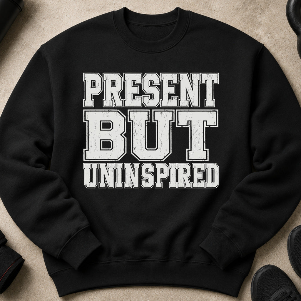 Black sweatshirt with distressed white text: "PRESENT BUT UNINSPIRED".