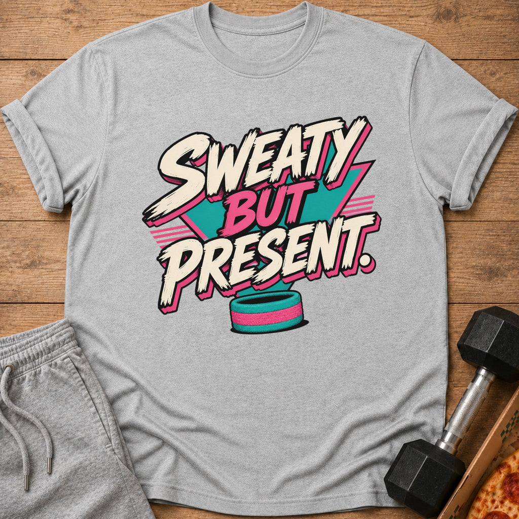 Grey t-shirt with "Sweaty But Present" text and fitness and pizza props.