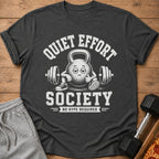 Dark t-shirt with "Quiet Effort Society" text and a tired kettlebell lifting weights.