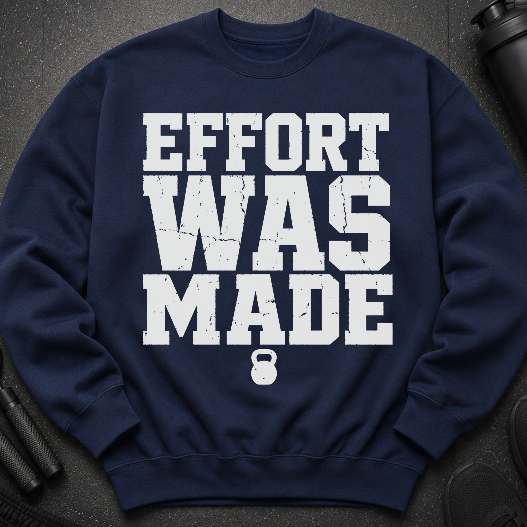Navy sweatshirt with white "EFFORT WAS MADE" text and a kettlebell graphic.