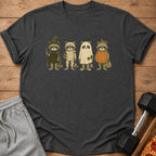 Four raccoons in Halloween costumes: witch, mummy, ghost, and pumpkin.