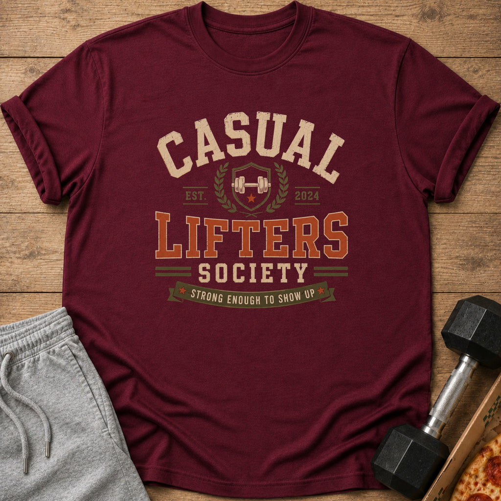 Maroon t-shirt with "Casual Lifters Society" text, barbell, and "Strong Enough To Show Up."
