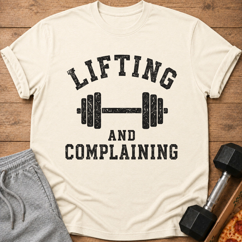 Cream t-shirt with black text "LIFTING AND COMPLAINING" and barbell graphic.
