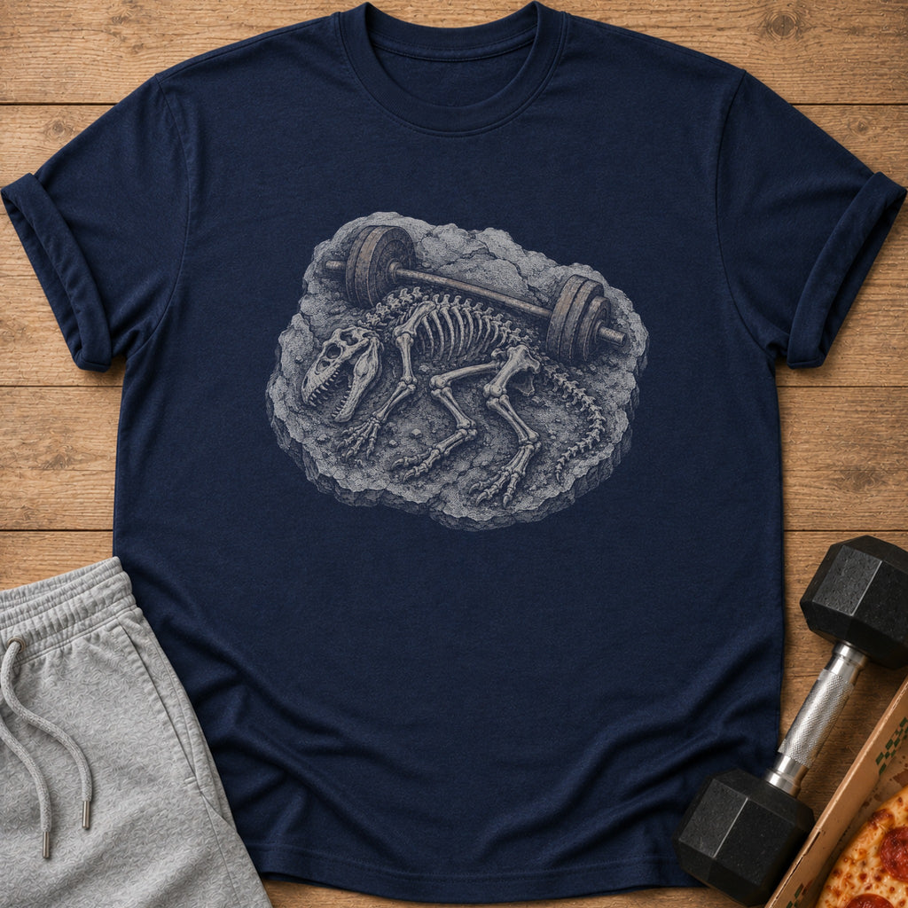 Dark blue t-shirt with a dinosaur skeleton and barbell graphic on a wooden background.