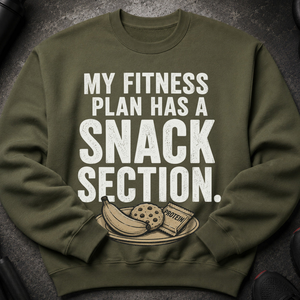 Olive green sweatshirt with white text about fitness and snacks.